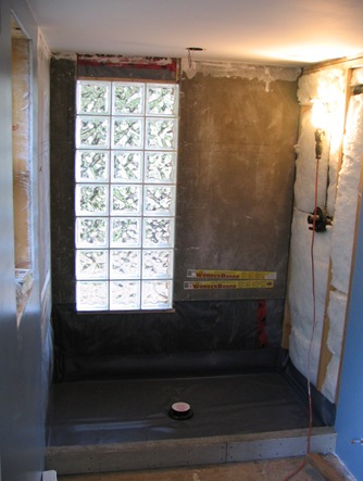 Building mexican style shower with glass block wall - by bruce witzel